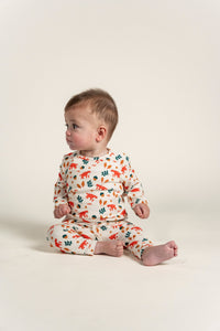 Toddler Boy Long Sleeve T-shirt with playful Fox Forest Print, featuring orange foxes, acorns, and green leaves on a soft cream base. Perfect for cozy wear and outdoor adventures.